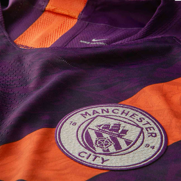 man city purple and orange kit